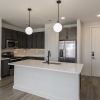 kitchen showing an island, bright lighting and modern appliances