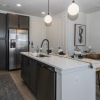 kitchen showing an island, bright lighting and modern appliances